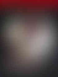 Cover of the Silent Hill Official Guide Book by Takasago. Dominating the artwork is a close-up of a highly detailed, bloodshot eye with a fiery red iris, reflecting an ominous image within. The area around the eye appears bruised and decayed, enhancing the horror aesthetic. At the top, a red band features the "TAKASAGO" logo. At the bottom, the title "SILENT HILL" appears in a distressed, metallic font, followed by “OFFICIAL GUIDE BOOK” in clean white text.