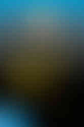 Book cover for "Python, PyGame and Raspberry Pi Game Development" by Sloan Kelly. The artwork shows a stylized laptop screen with colorful game elements and a crosshair, connected to a game controller, representing coding and gameplay on the Raspberry Pi platform.