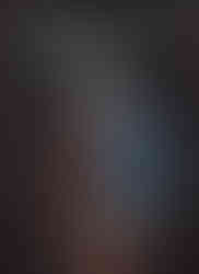 Cover of Dark Souls: Redemption Vol. 2 – Bonfire by Julien Blondel and Shonen. A wounded, muscular warrior with visible scars stands with his back turned, holding a large, ornate blue shield and a sword. He wears a distinctive, spiked helmet, evoking the iconic look from the Dark Souls series. The background is black, enhancing the stark, somber tone. The volume number "2" and subtitle "Bonfire" appear on the left side. The title is displayed at the top in bold, stylized text.