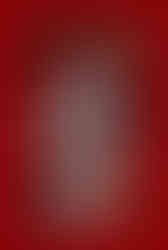 Cover of Disney Twisted-Wonderland: The Novel – Episode 1: Crimson Tyrant, featuring a red-haired character dressed in a regal, fantasy-inspired uniform with gold and black accents, holding a scepter topped with a heart-shaped crown. The background is deep red with card suit symbols and rose motifs, emphasizing the theme inspired by "Alice in Wonderland."