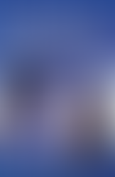 The image is the cover of a book titled "Game On, Hollywood! Essays on the Intersection of Video Games and Cinema." The cover features Ramona Flowers from Scott Pilgrim vs. the World. She has blue hair and os looking intently at the viewer, holding a giant sledgehammer, suggesting a blend of gaming and movie elements. The title text is prominent, with the words "Game On, Hollywood!" in large, bold letters, set against a dynamic blue background that conveys movement and energy. Below the title, the subtitle "Essays on the Intersection of Video Games and Cinema" indicates that the book contains a collection of essays exploring the relationship between the gaming industry and the film industry. Edited by Gretchen Papazian and Joseph Michael Sommers, the book is likely an academic or scholarly work, discussing themes such as narrative, aesthetics, technology, and the cultural impact of the convergence of video games and movies. The cover is designed to attract readers interested in media studies, game studies, and film studies, as well as those intrigued by the cross-pollination of these two popular forms of entertainment.