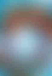 Cover of Street Fighter Ultimate Art Portfolio featuring Chun-Li in her signature blue outfit, summoning a glowing energy ball between her hands with intense focus. Blue energy swirls around her against a warm, red-orange background, emphasizing her iconic move and dynamic power.