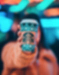 woman%20on%20brown%20jacket%20showing%20green%20and%20brown%20Starbucks%20coffee%20cup_edited.jpg