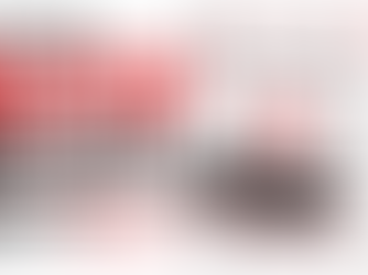 Student comparing laptop specifications in 2026 on a modern black and red laptop against a clean white background.