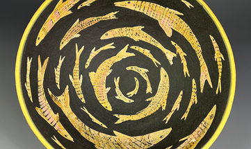 Stoneware bowl with circular fish patterning.
Kate Sampson