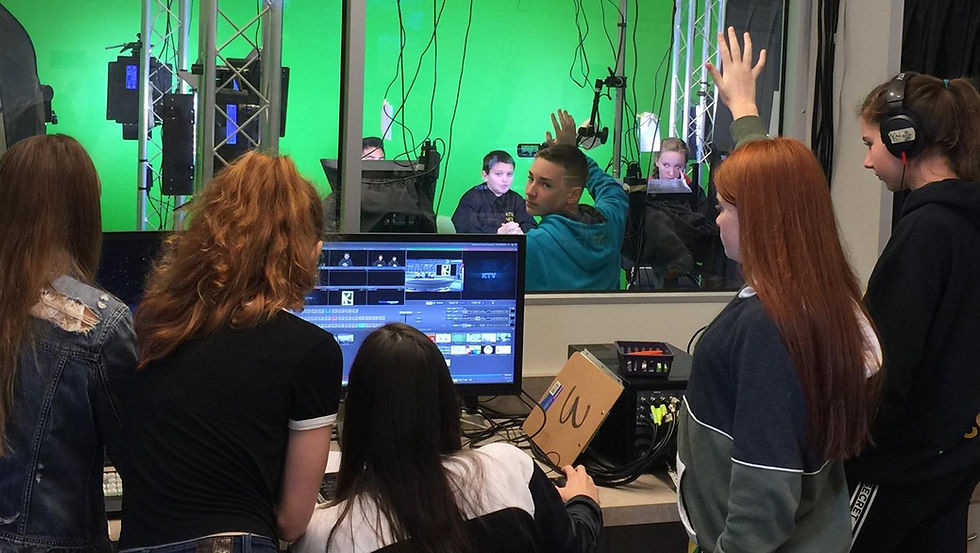 A group of students in a green screen room