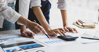 Small business owners receiving financial consulting and cash flow management advice from SAVVY.