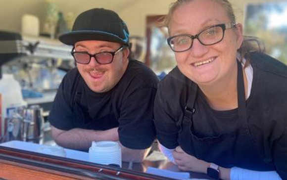 community members working at cafe on corporation