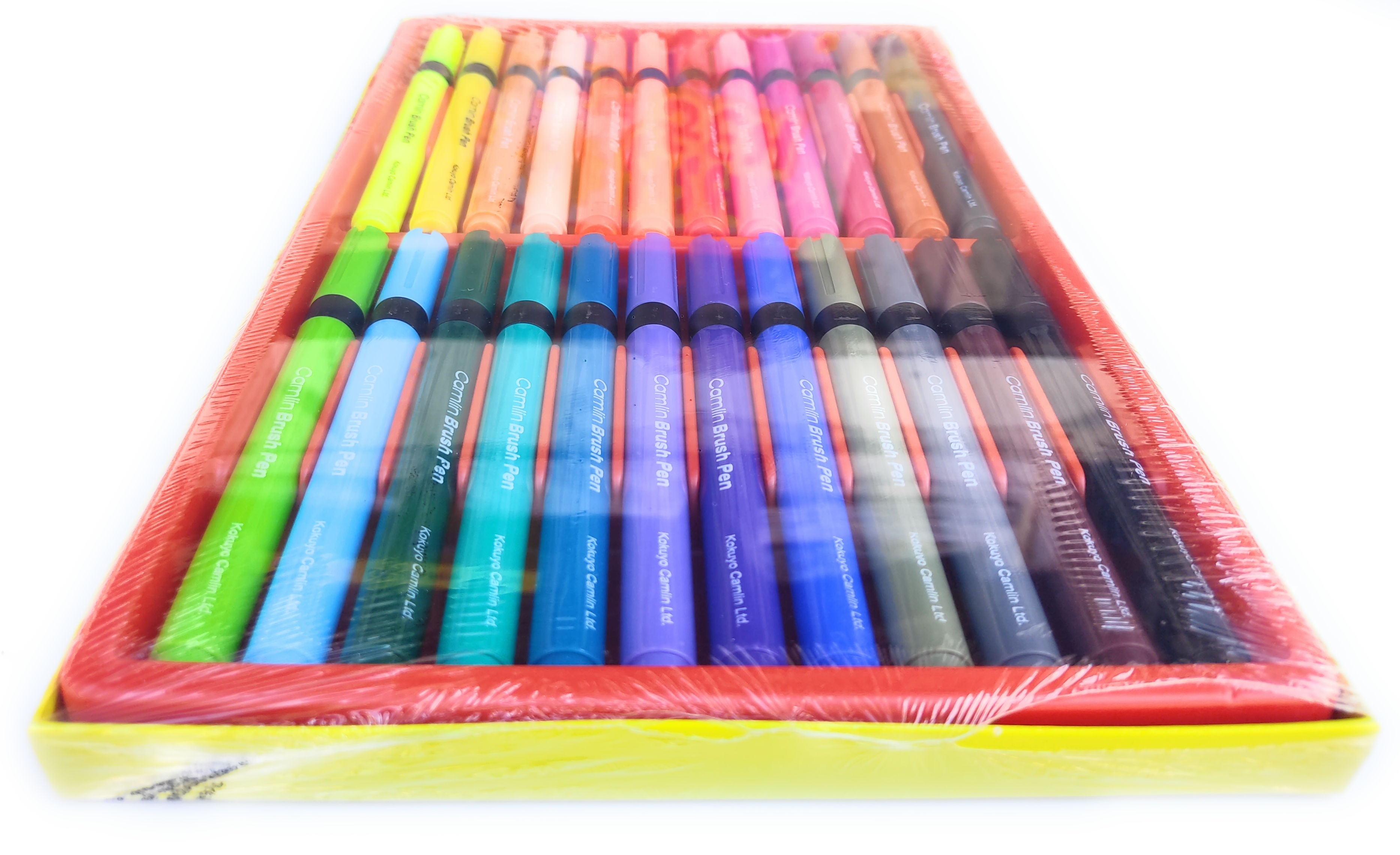 Camlin brush pen set with multiple vibrant color shades for creative artwork and calligraphy