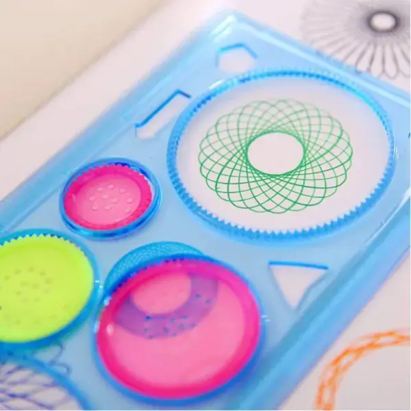 Thumbnail: Close-up of geometric drawing ruler kit creating intricate spiral patterns