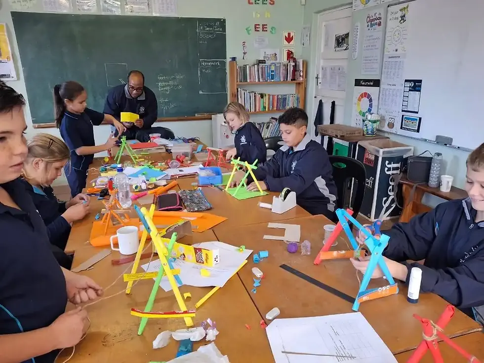 Children creating colorful art and craft projects in a classroom.
