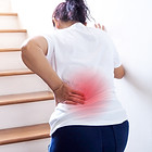 young-thai-asian-woman-suffering-low-back-pain-waist-lumbar-pain-when-walking-up-stairs.jp