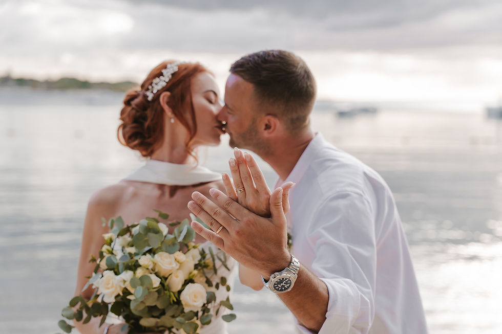 Symbolic wedding ceremony in Mauritius with couple exchanging vows on the beach at sunset captured by professional photographer