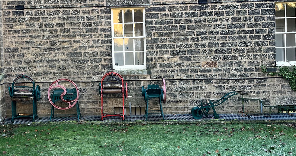 Old fashioned mangles outside of a museum