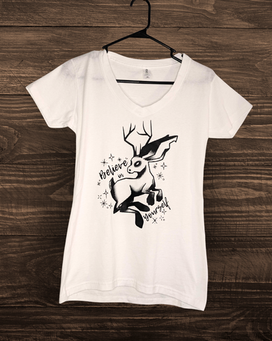 A v-neck shirt with a jackalope on it. The text reads: Believe in yourself. 