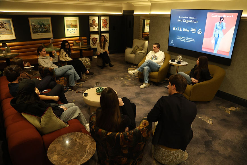 Students watching "KING'S COLLEGE LONDON BALLET MAY" on screen, luxury student living.