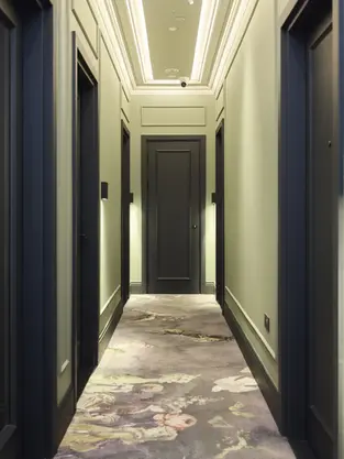 Elegant hotel corridor with marble floor