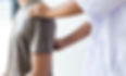 Doctor examining a patient's shoulder and back
