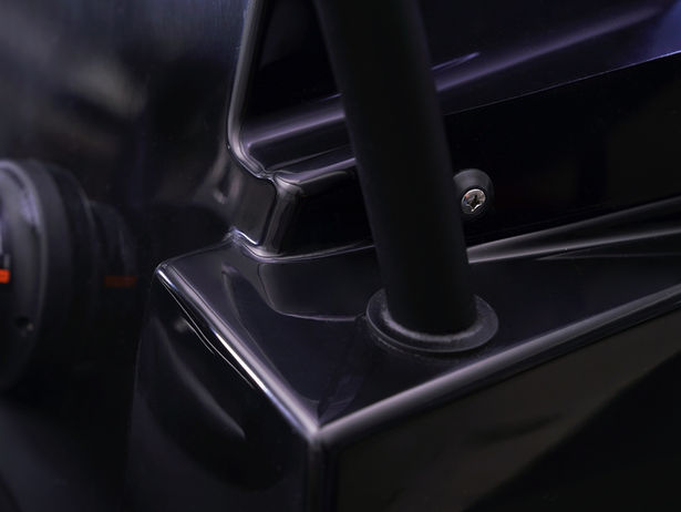 Black vehicle component with roll bar