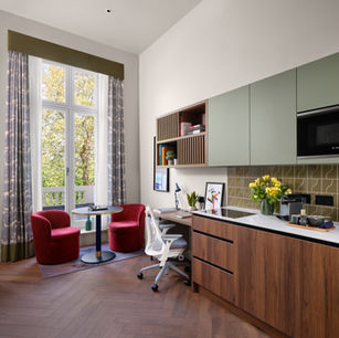 Modern apartment kitchen and workspace with large window