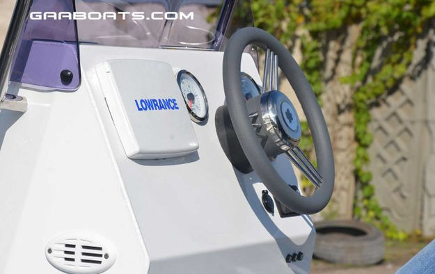 ATLANTIS boat helm with Lowrance display