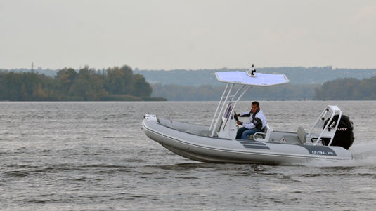 Person driving a VIKING V500 boat on water