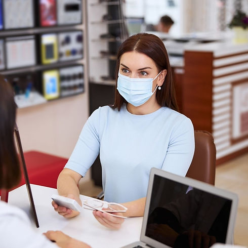 woman-asking-the-optician-about-the-best-eyewear-v-2021-09-03-09-46-45-utc (1).jpg