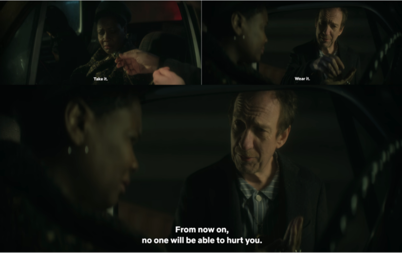 John Burgess gives the Amulet of Protection to Rosemary.