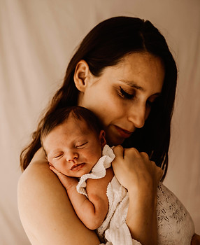 A mother cradling her baby