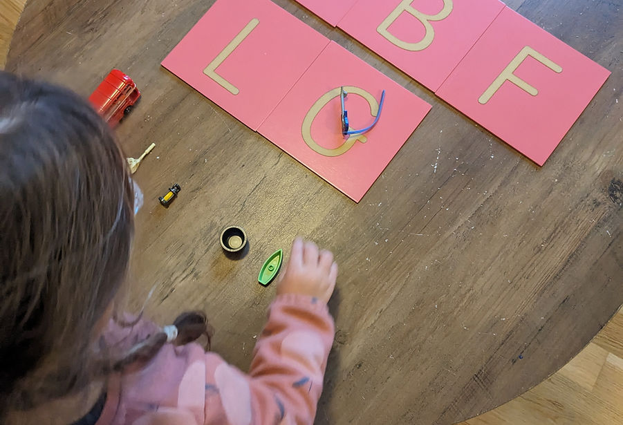 A girl learning letter sounds