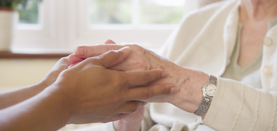 Elderly care hands holding