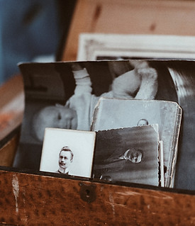 old photos in brown wooden chest_edited.