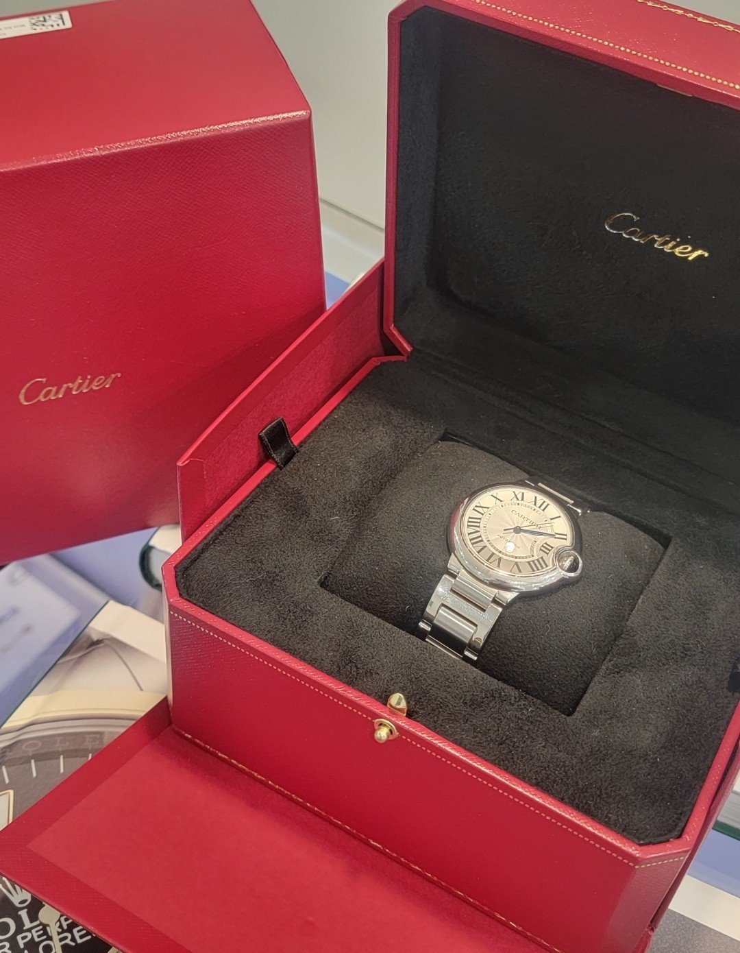 A watch in its presentation case — Le Lion d’Or