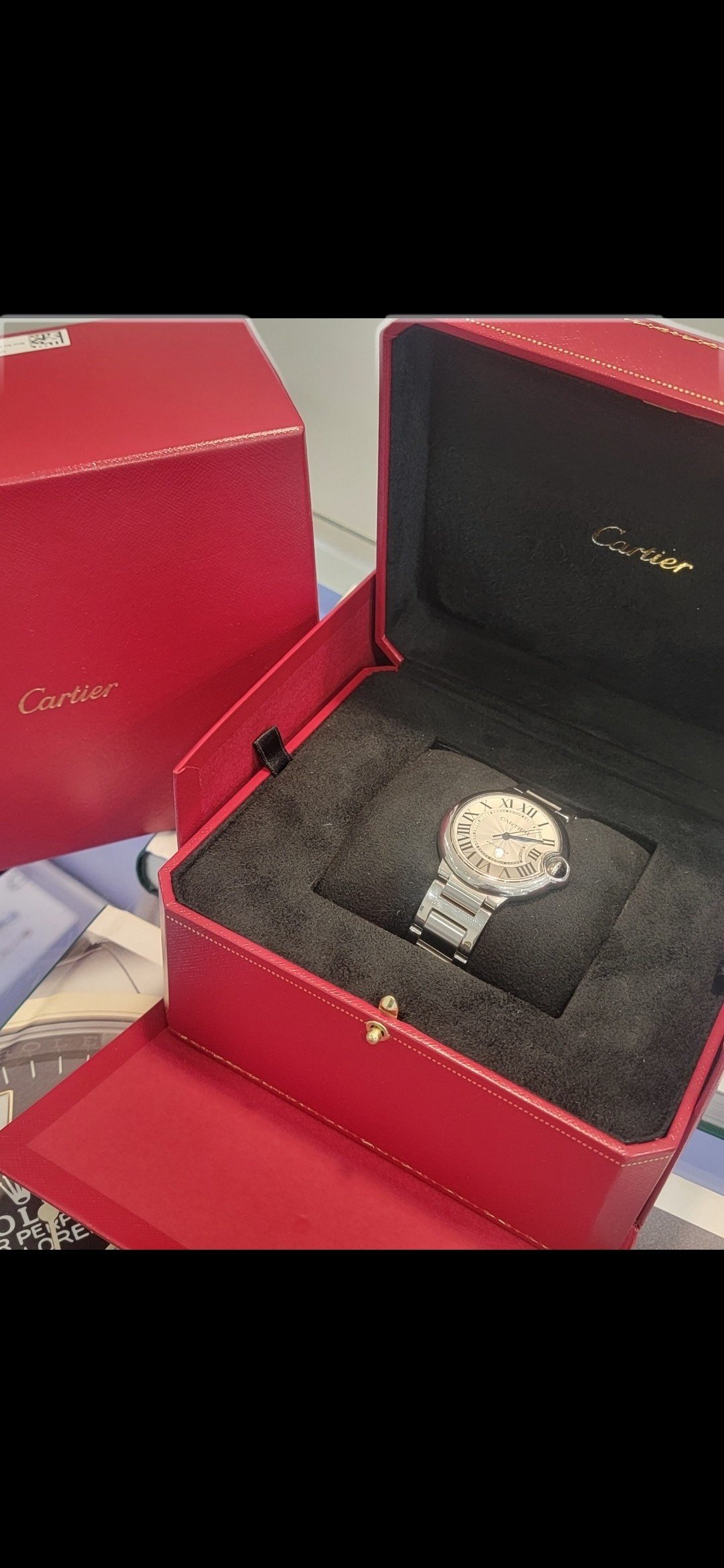 A watch in its presentation case — Le Lion d’Or