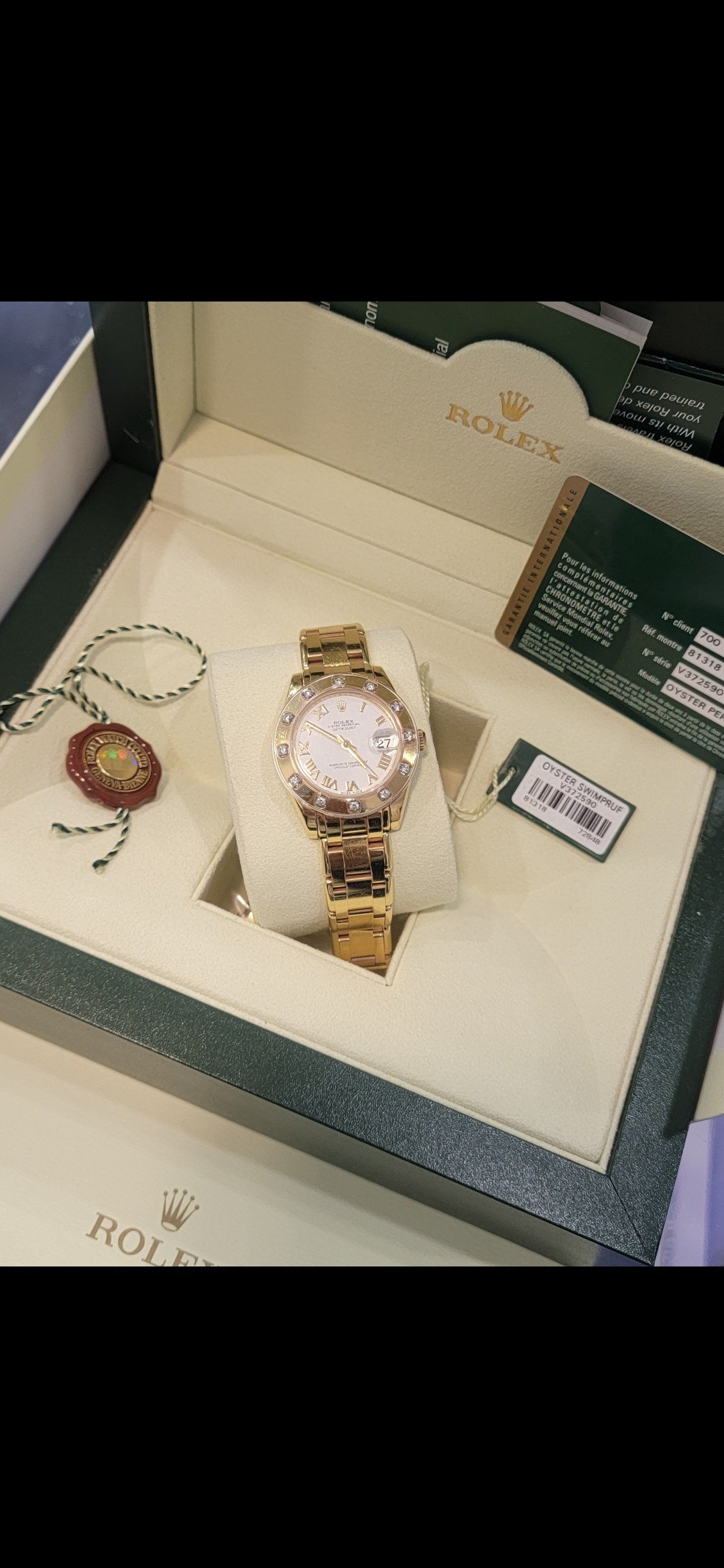 A gold-tone timepiece — Le Lion d’Or
