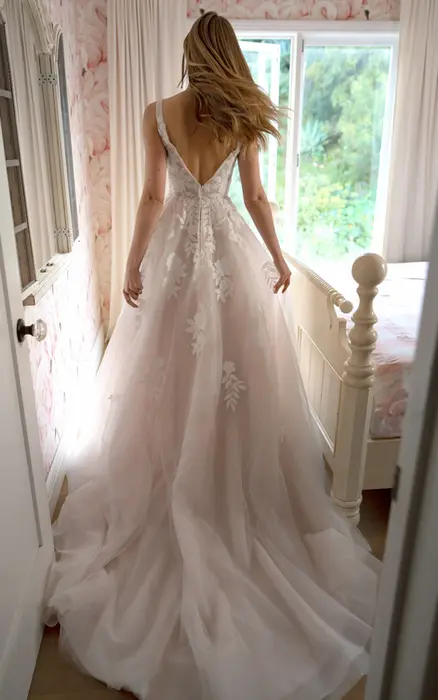 Stella York SY8316 ivory wedding dress size 20 at Wedding Belles Love Stone Staffordshire featuring floral lace appliqués, deep V plunge neckline and flowing A line skirt.