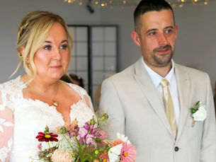 Bride wearing a classic A line wedding gown with ocean views in Ilfracombe.