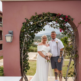 Bride wearing a fitted Mavery Hugh wedding dress at The Balcony in Zakynthos, Greece.