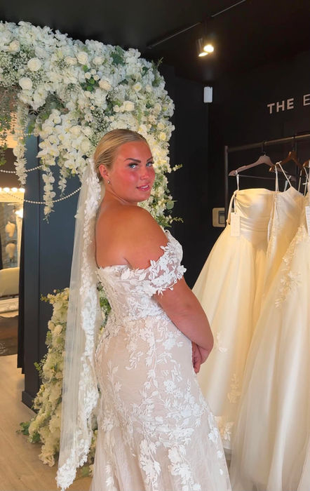 Lenora by Mavery Hugh wedding dress size 12 ivory over champagne at Wedding Belles Love Stone Staffordshire featuring a fitted silhouette, corset bodice and botanical lace.