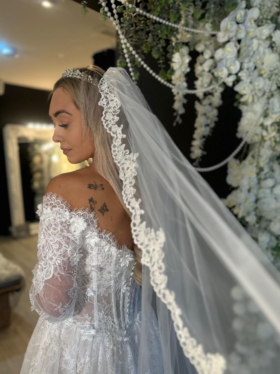 Delphine by Mavery Hugh wedding dress at Wedding Belles Love Staffordshire showcasing delicate Chantilly lace ballgown
