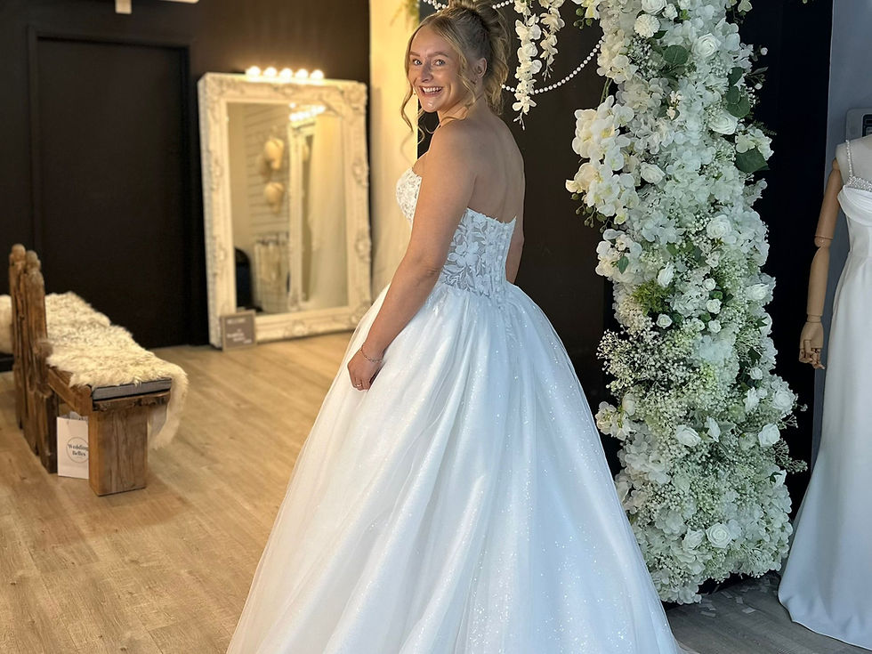 Bride celebrating finding her dress in a shop