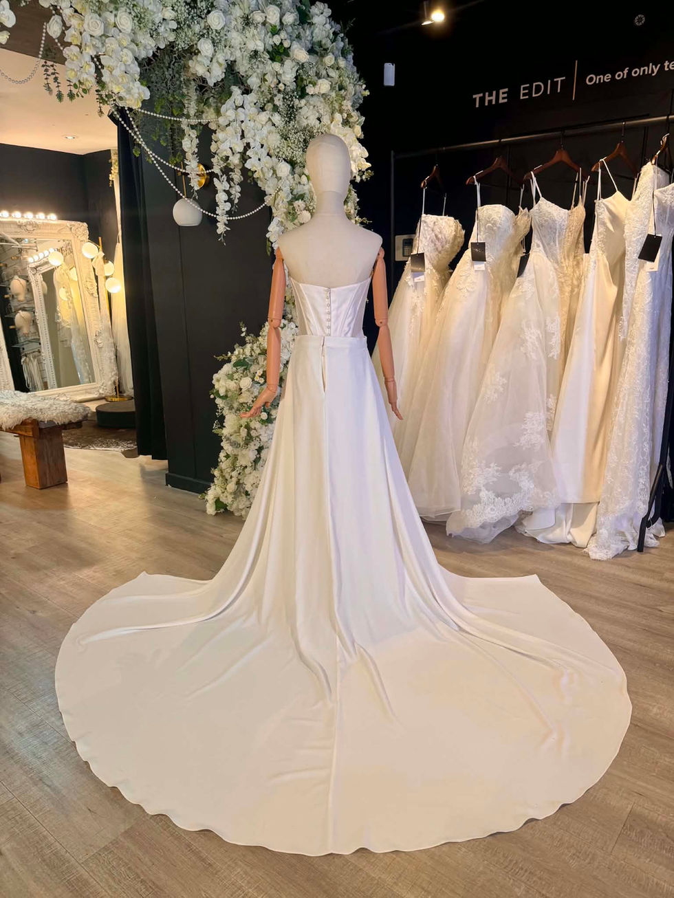 Ivory detachable crepe hip to hip bridal overskirt size 12 with dramatic sweeping wedding dress train at Wedding Belles Love.