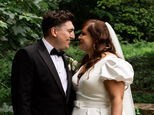 Bride wearing a classic Stella York wedding dress, captured in a joyful moment.