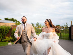 Bride in a classic yet contemporary Stella York wedding dress, photographed on her wedding day.