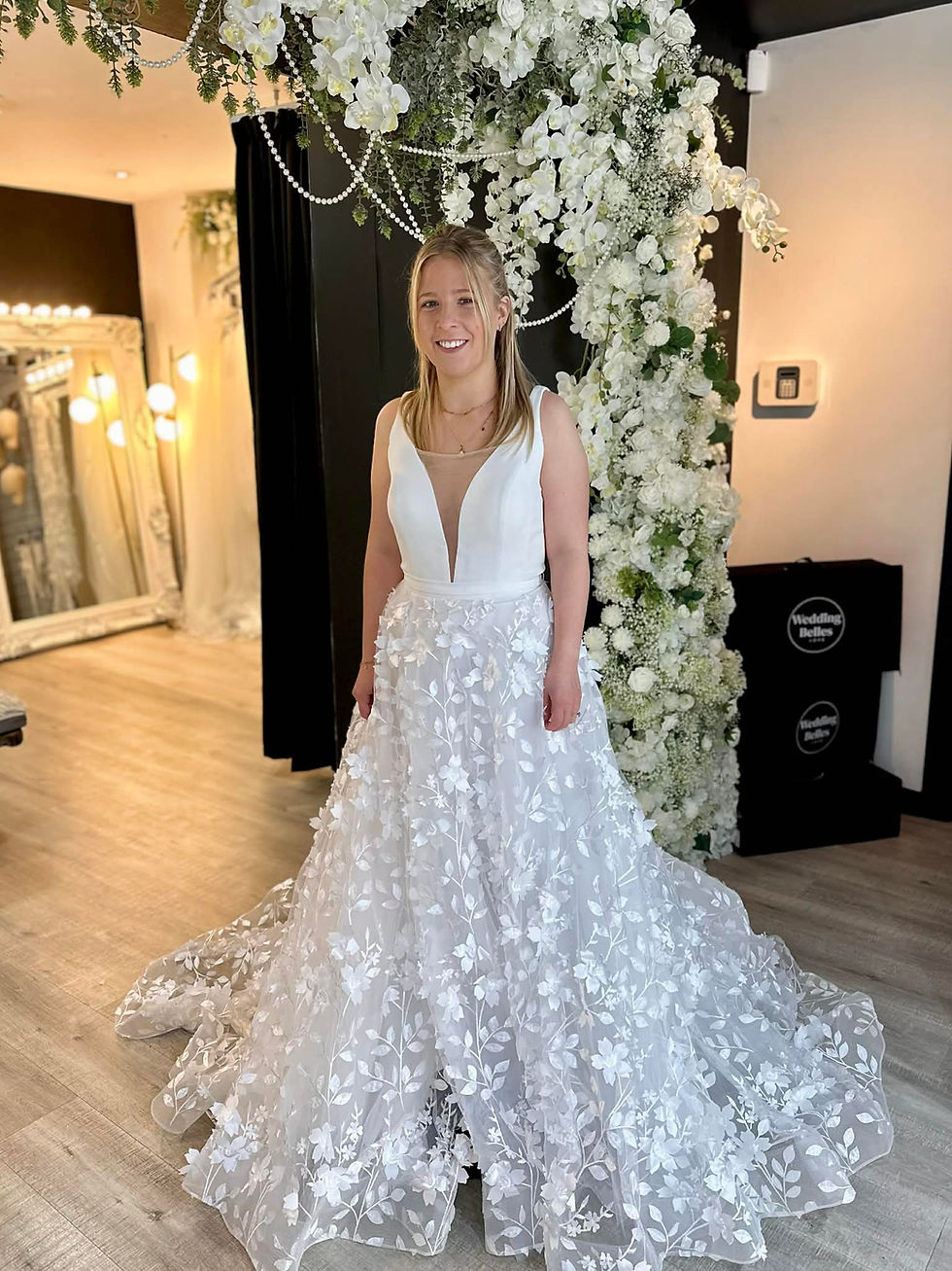Bridgette wedding dress with plunge neckline bodice and 3D floral lace A line skirt available at Wedding Belles Love bridal boutique in Stoke on Trent