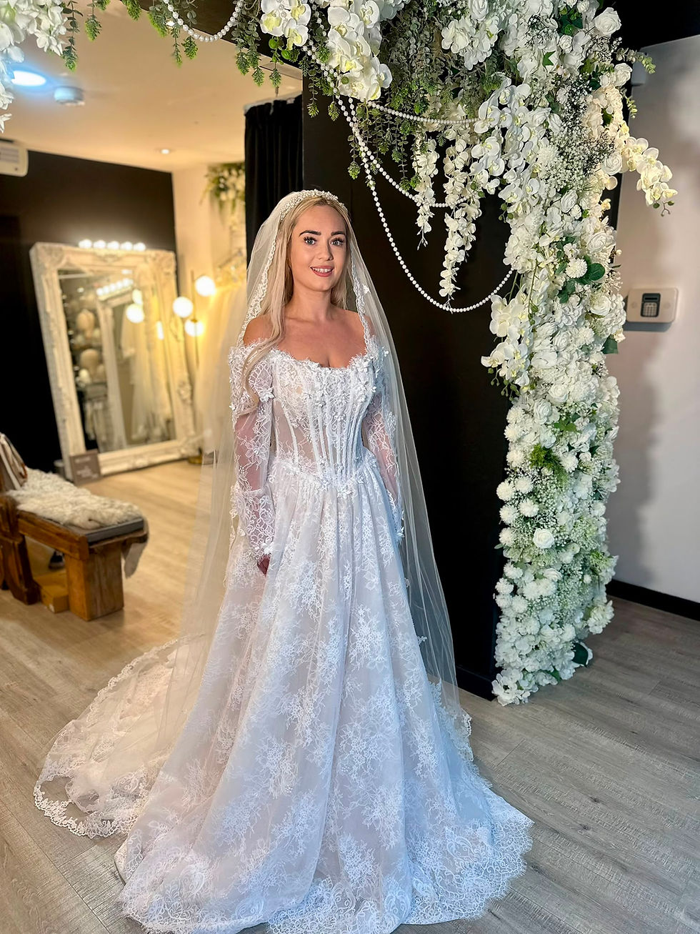 Delphine by Mavery Hugh wedding dress at Wedding Belles Love Staffordshire showcasing delicate Chantilly lace ballgown