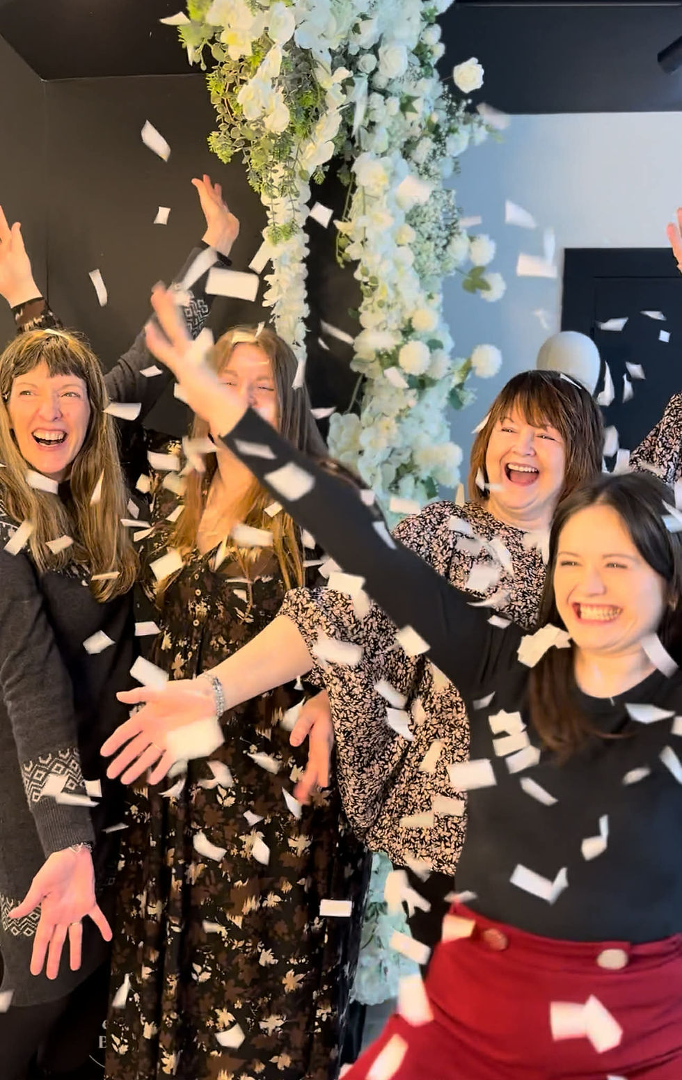 Bride browsing designer wedding gowns inside Wedding Belles Love, a luxury bridal boutique located in Stone, Staffordshire.