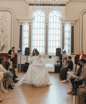 Soft romantic bridal look with layered organza skirt.