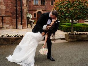 Bride wearing a fitted bridal gown with classic elegance at Colshaw Hall.