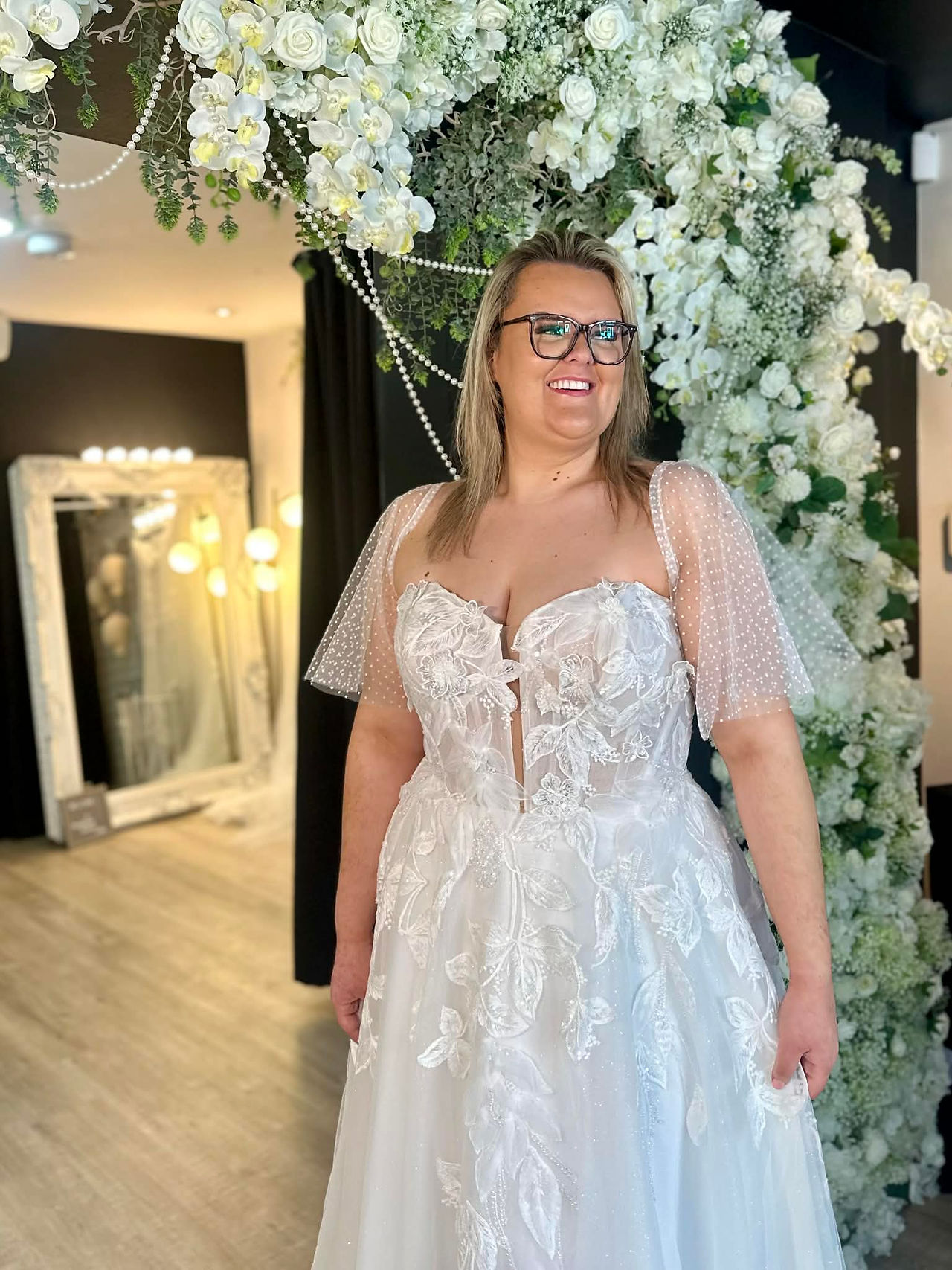Classic ivory Stella York bridal dress with clean satin finish and contemporary square neckline.